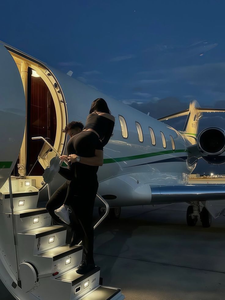 Liam K. shot beside a private jet