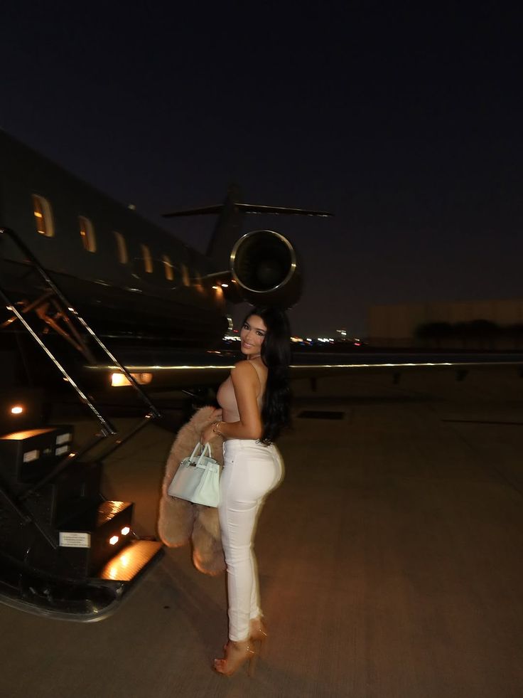 Maya S. shot beside exotic cars